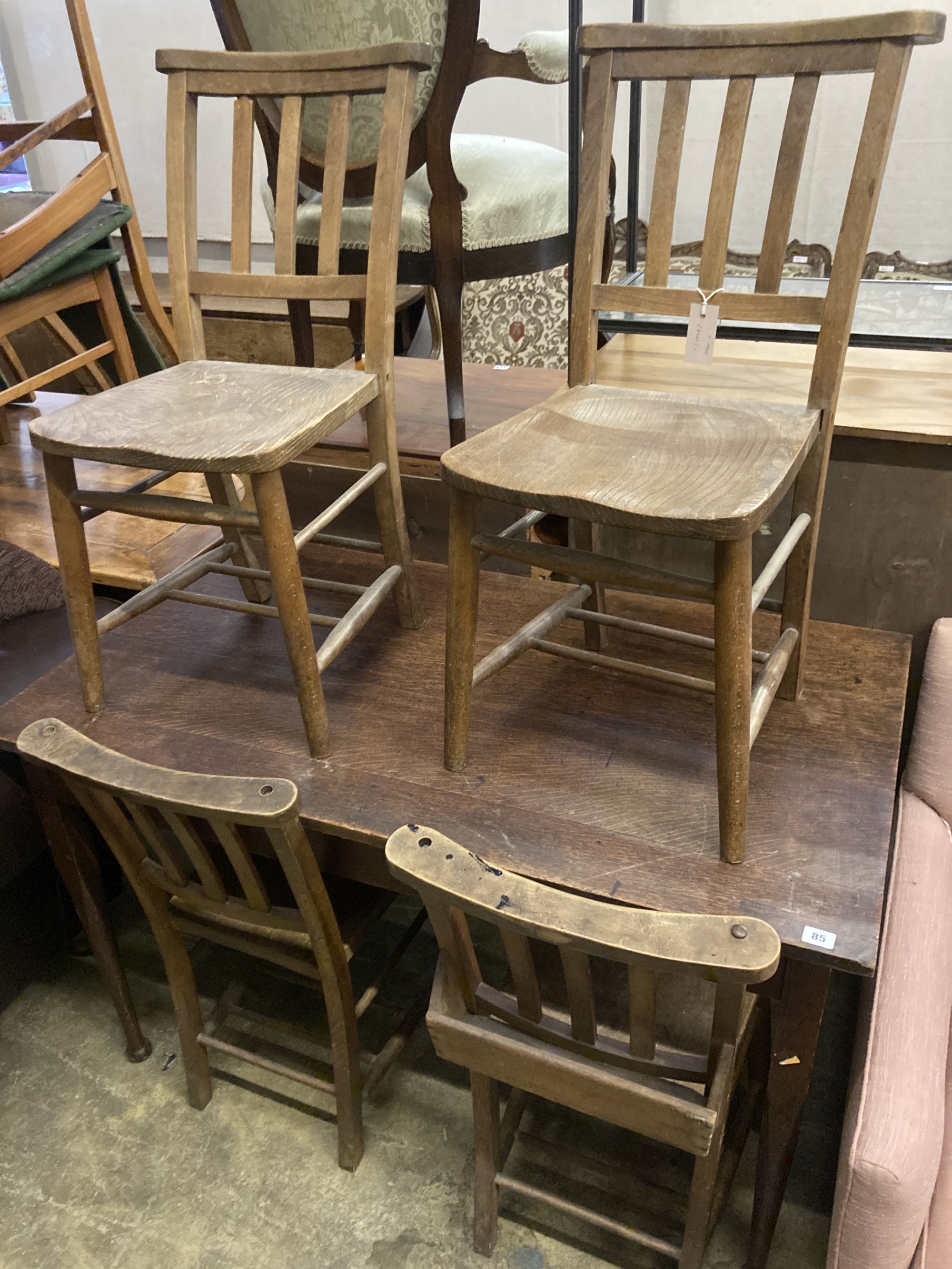 A late Victorian rectangular oak table, width 122cm, depth 69cm, height 74cm together with four church chairs